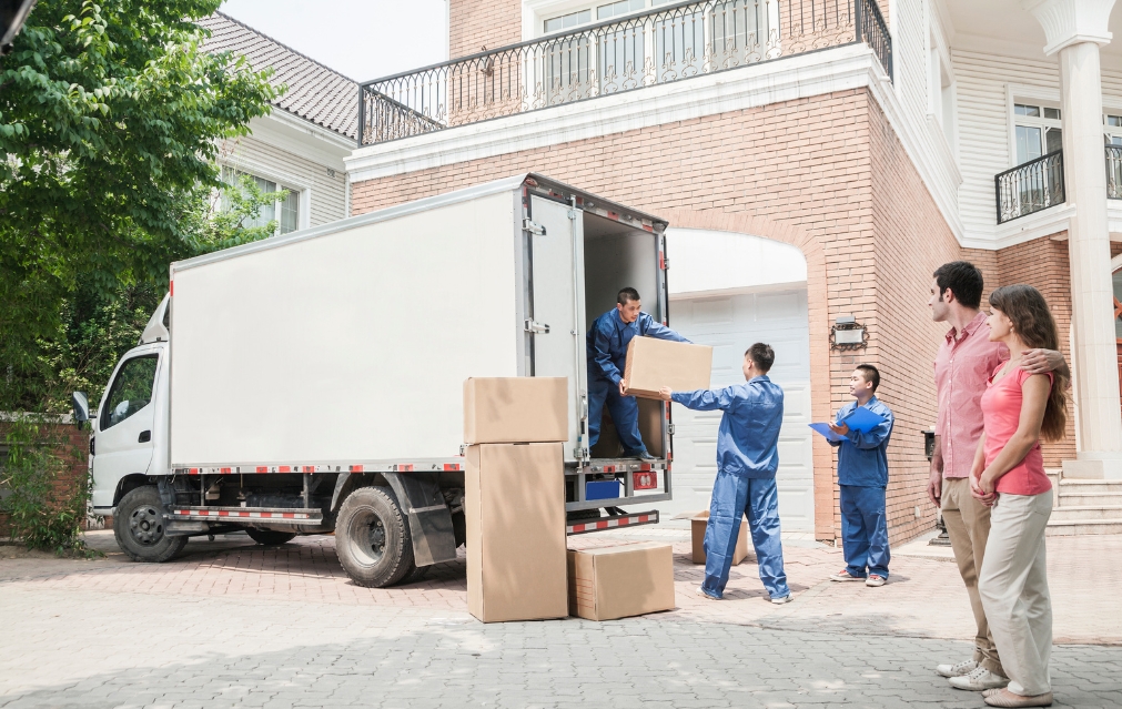 Gati Home moving truck parked outside a house