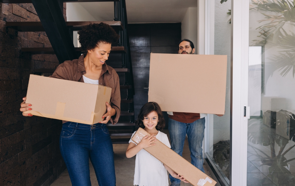 Movers wrapping furniture before shifting